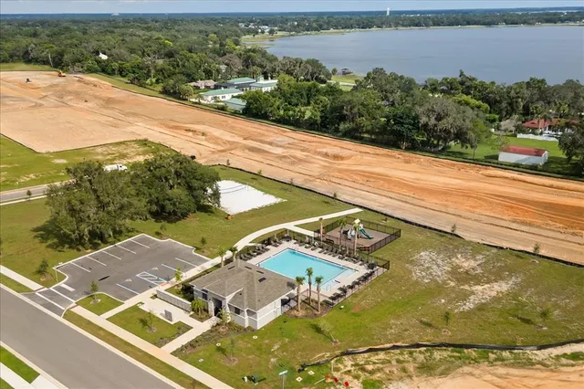 a view of a lake with houses in the background