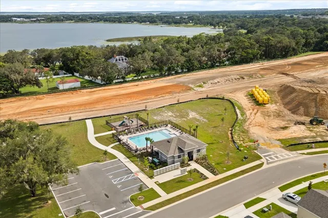a view of a swimming pool with lawn chairs