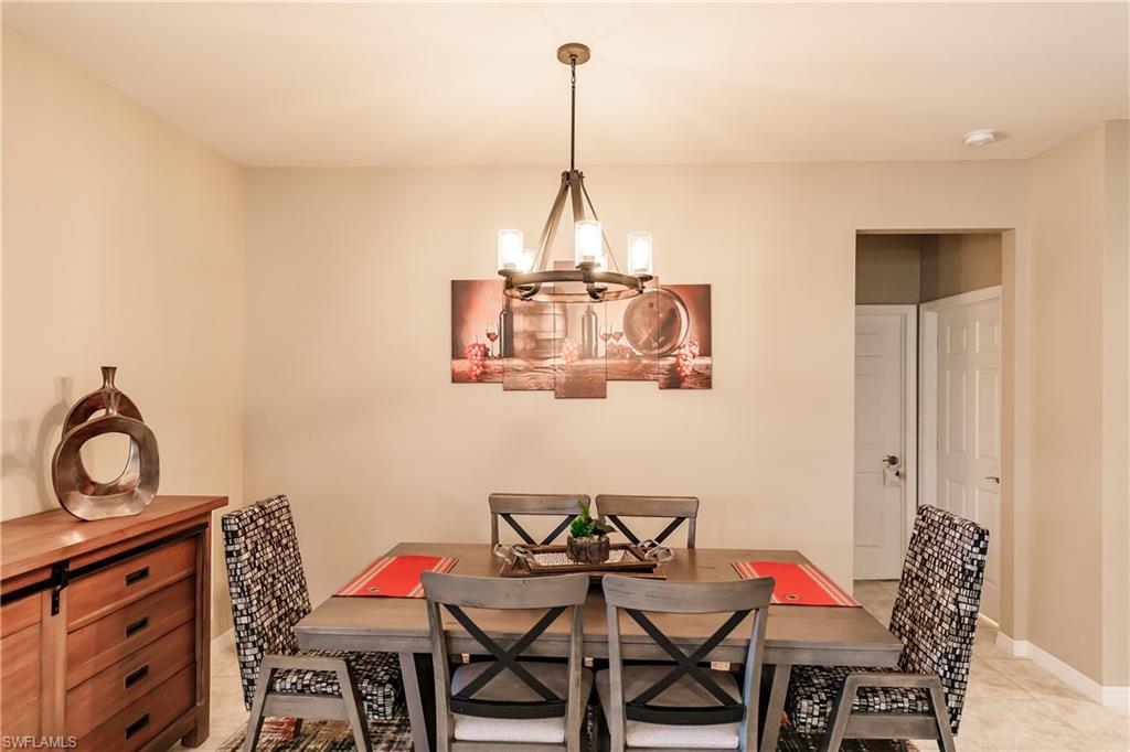 10883 Dennington Road Fort Myers, FL 33913 - Photo 12 of 32 a dining room with furniture and window