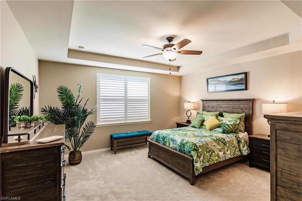10883 Dennington Road Fort Myers, FL 33913 - Photo 13 of 32 a bedroom with a bed couch table and a window