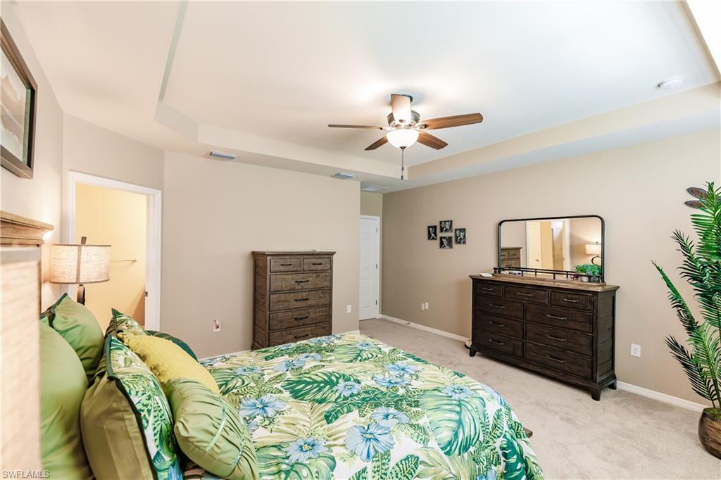 10883 Dennington Road Fort Myers, FL 33913 - Photo 14 of 32 a bedroom with a bed dresser and a window