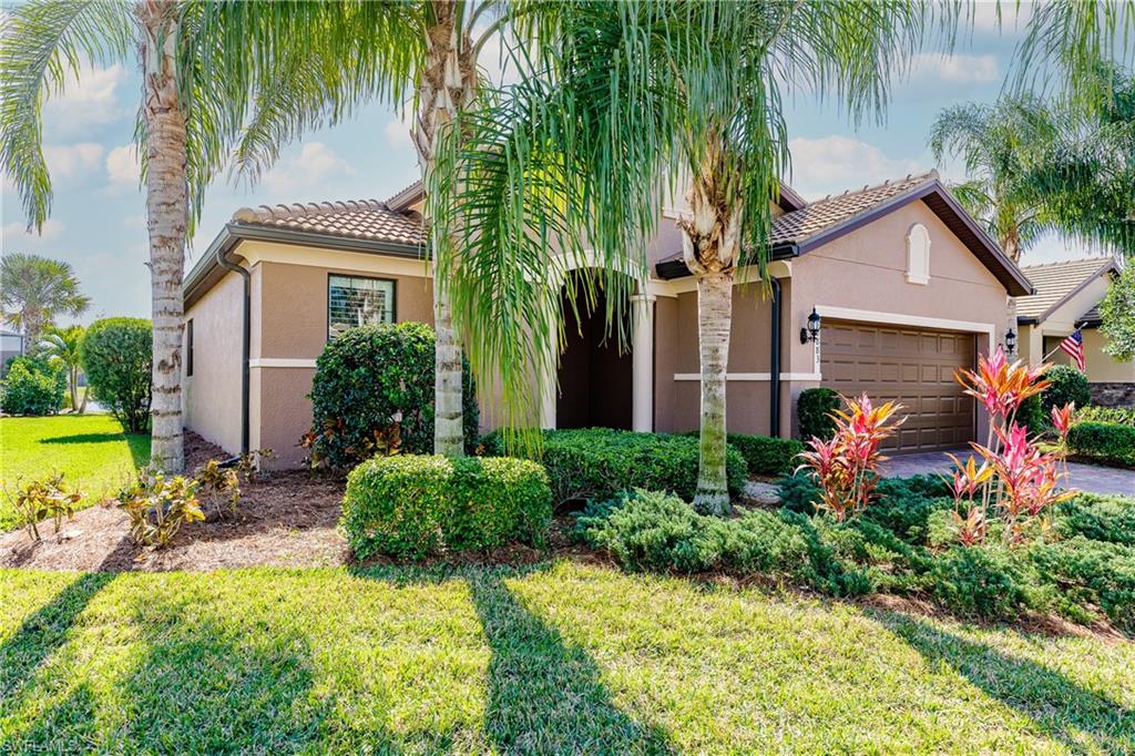 10883 Dennington Road Fort Myers, FL 33913 - Photo 2 of 32 a front view of house with yard and swimming pool