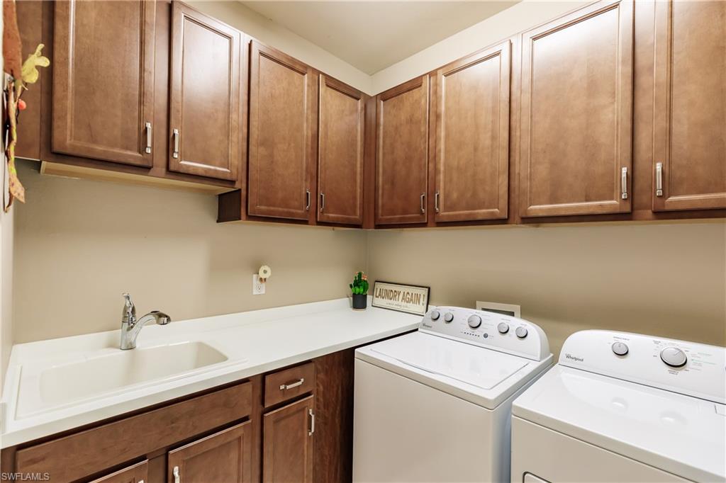 10883 Dennington Road Fort Myers, FL 33913 - Photo 23 of 32 a utility room with dryer and washer