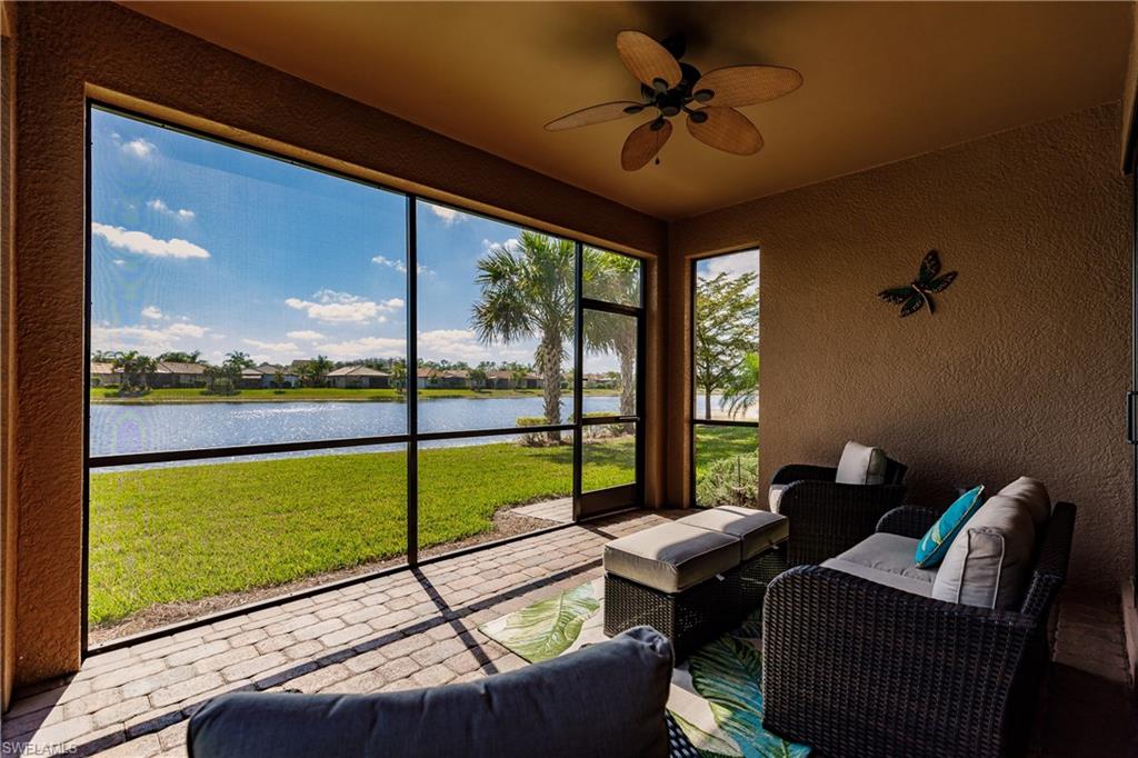 10883 Dennington Road Fort Myers, FL 33913 - Photo 25 of 32 a living room with couch and a floor to ceiling window