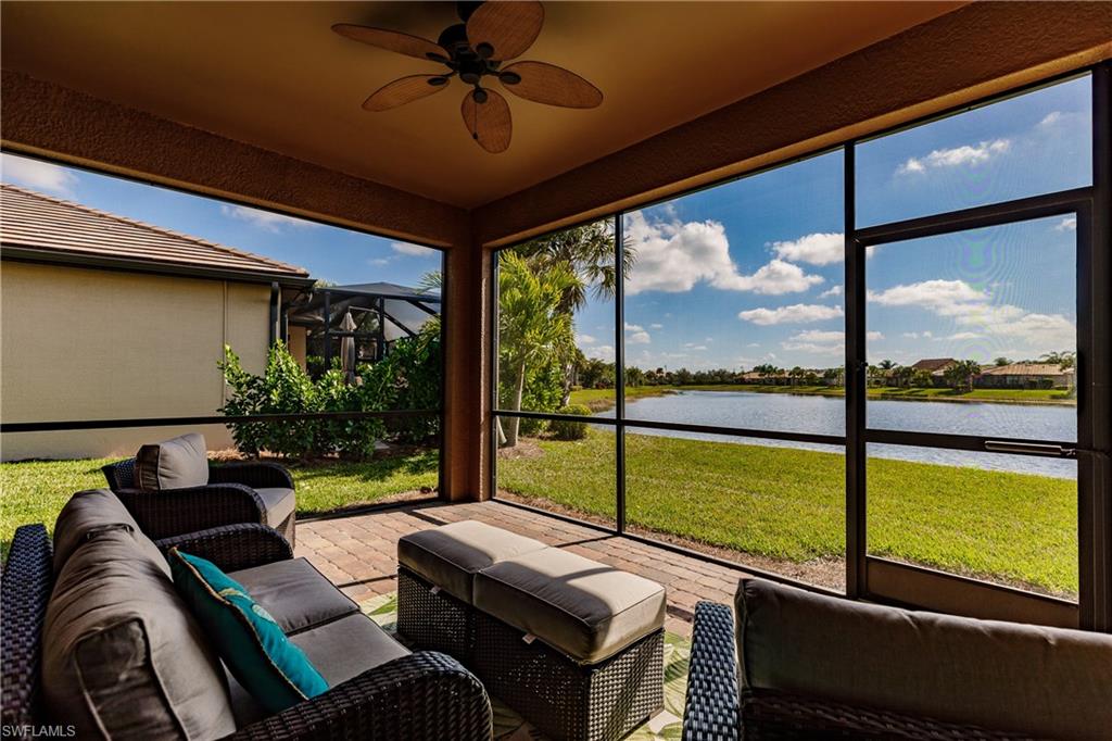 10883 Dennington Road Fort Myers, FL 33913 - Photo 26 of 32 a living room with furniture and a floor to ceiling window
