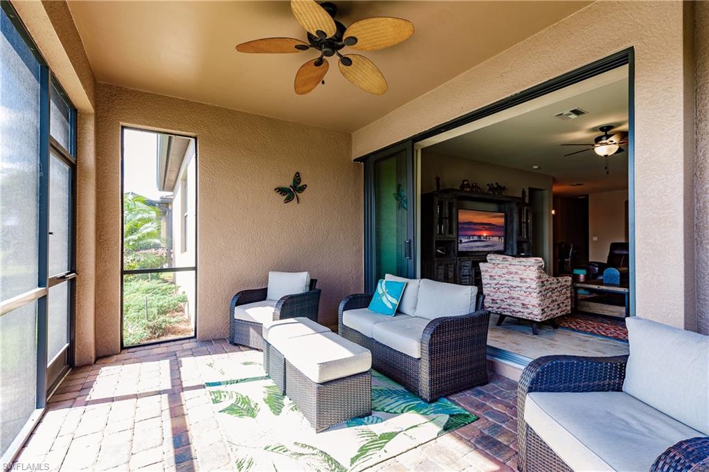 10883 Dennington Road Fort Myers, FL 33913 - Photo 27 of 32 a living room with furniture and a large window