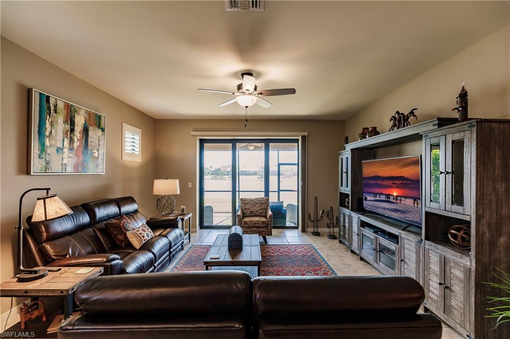 10883 Dennington Road Fort Myers, FL 33913 - Photo 5 of 32 a living room with furniture and a flat screen tv