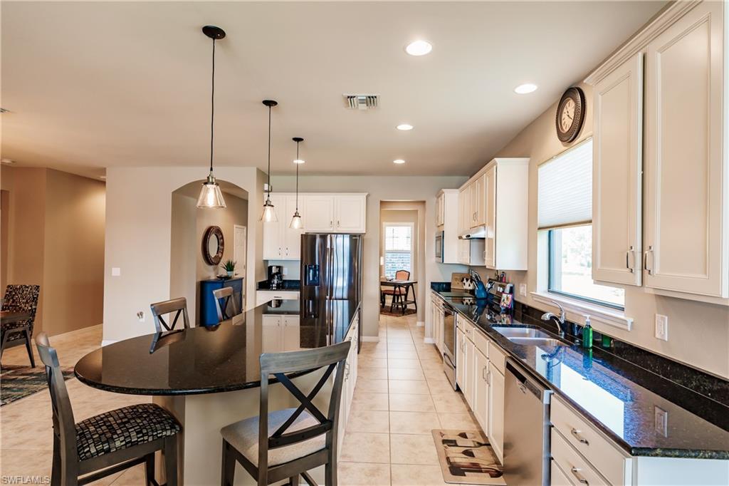 10883 Dennington Road Fort Myers, FL 33913 - Photo 10 of 32 a very nice looking kitchen with a large window and stainless steel appliances