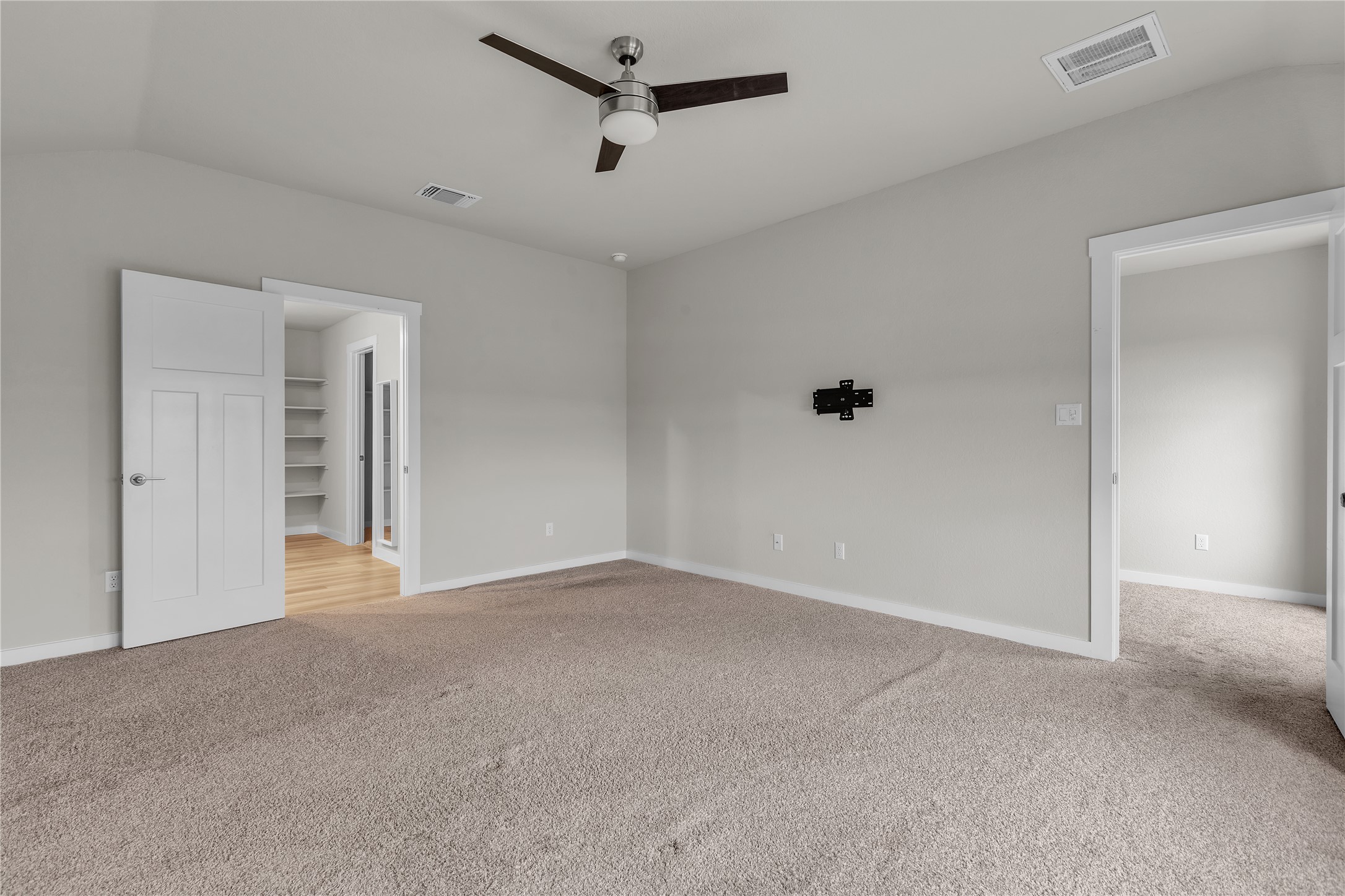 1212 Tipton Street Georgetown, TX 78633 - Photo 10 of 20 An airy primary bedroom features a ceiling fan, plush carpeting, and access to a well-organized closet.