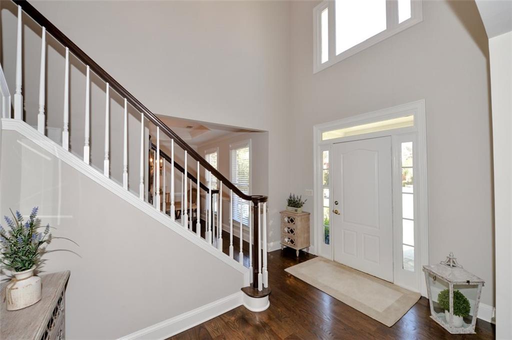 310 Windsor Gate Cove Northeast Atlanta, GA 30342 - Photo 11 of 58 a view of entryway with wooden floor and stairs
