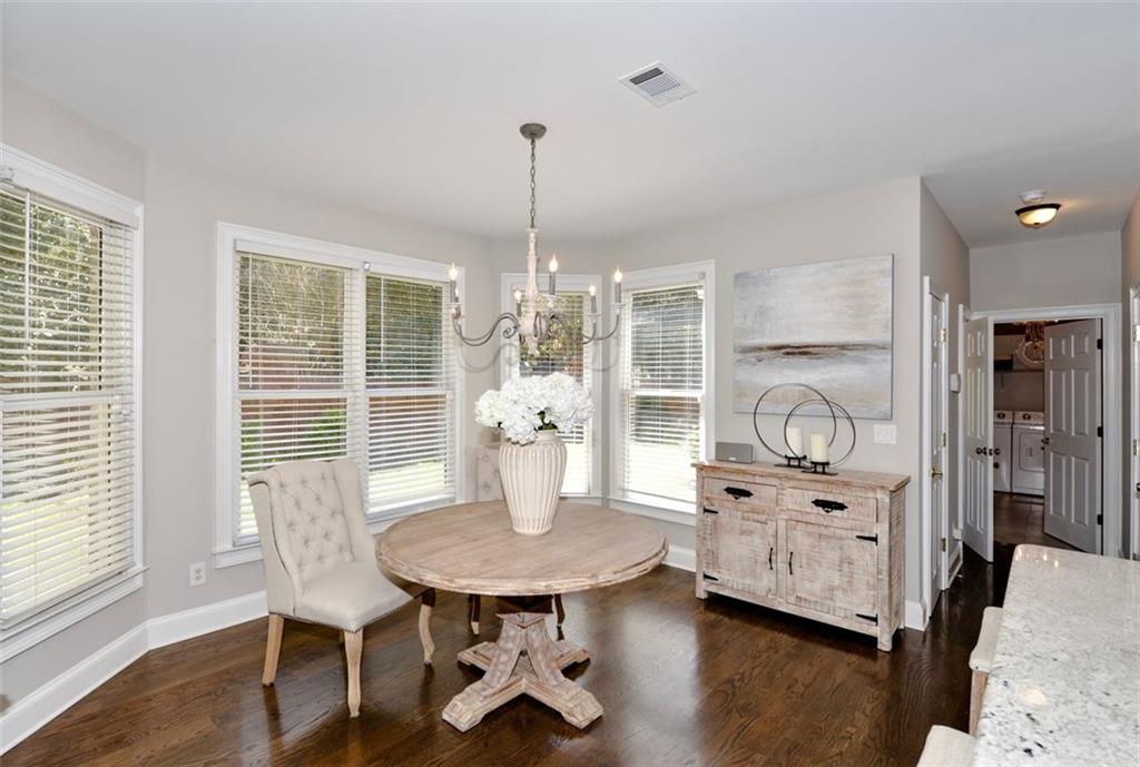 310 Windsor Gate Cove Northeast Atlanta, GA 30342 - Photo 18 of 58 a view of a dining room with furniture and window