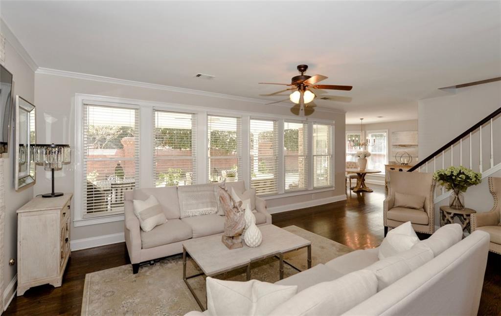 310 Windsor Gate Cove Northeast Atlanta, GA 30342 - Photo 26 of 58 a living room with furniture and a large window