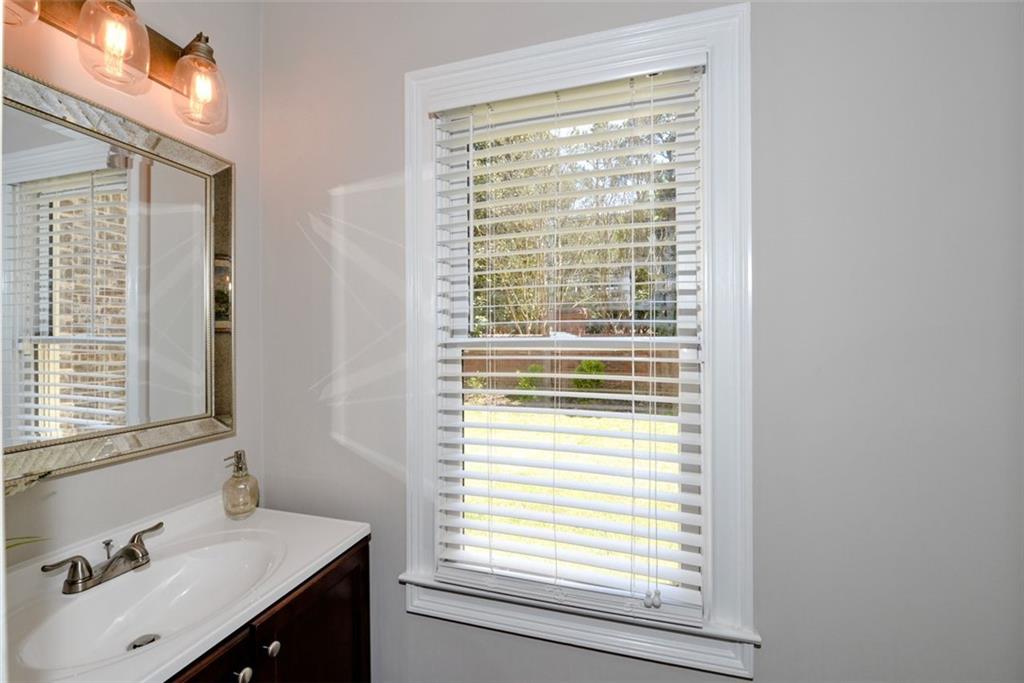 310 Windsor Gate Cove Northeast Atlanta, GA 30342 - Photo 30 of 58 a bathroom with a sink and a vanity