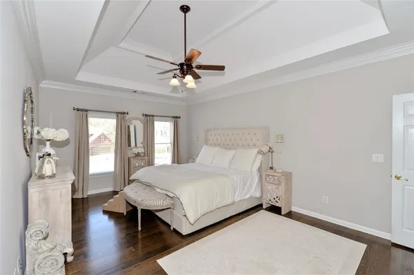 a spacious bathroom with a sink a large mirror and a bathtub