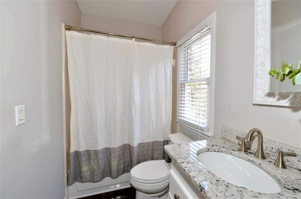 310 Windsor Gate Cove Northeast Atlanta, GA 30342 - Photo 51 of 58 a bathroom with a sink toilet and shower