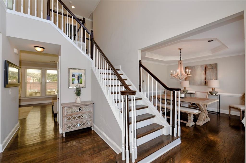 310 Windsor Gate Cove Northeast Atlanta, GA 30342 - Photo 10 of 58 a view of entryway and hall with wooden floor