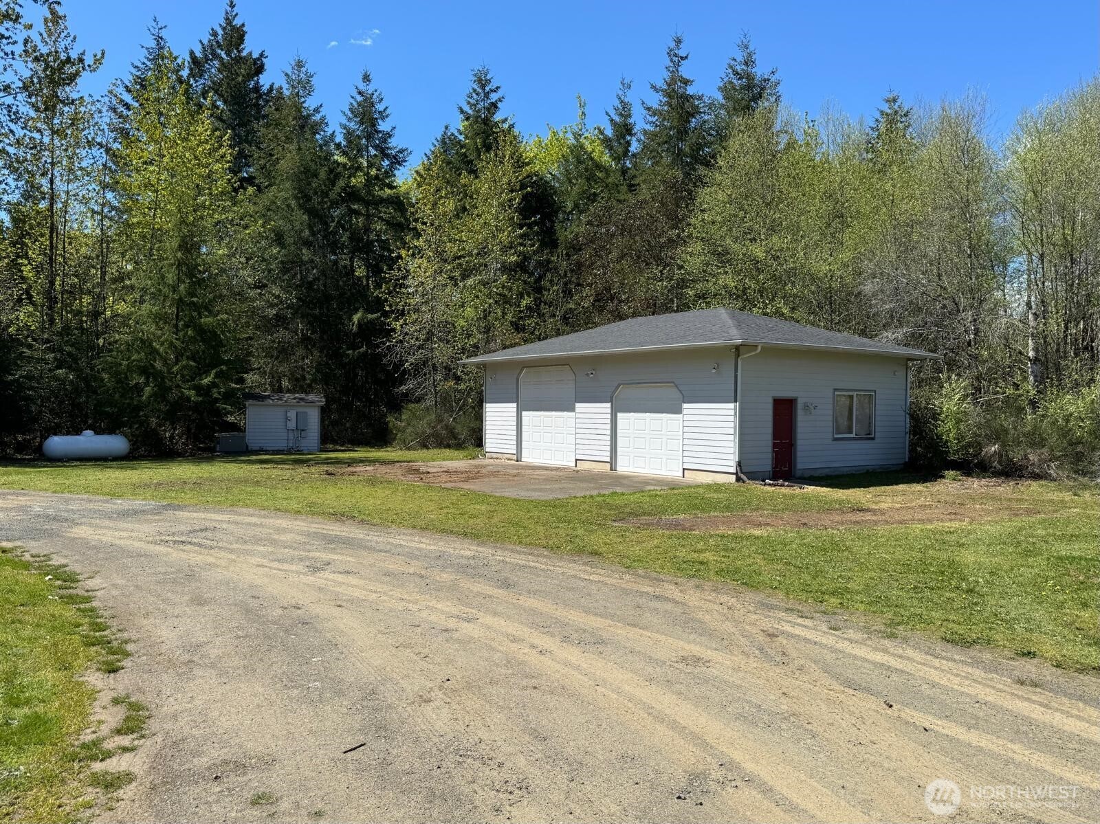 151 West Clark Road Shelton, WA 98584 - Photo 32 of 34 a view of a house with a yard and trees