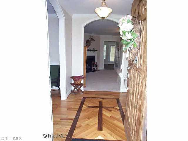 Other. Entry with inlaid walnut and red oak harwood floor