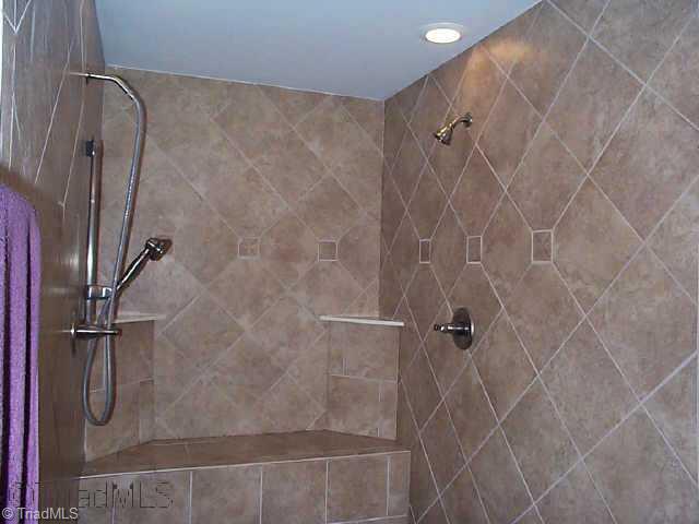 4910 Warner Road Pfafftown, NC 27040 - Photo 8 of 9 Other. Walk in tiled master bath shower with dual shower heads and bench seat
