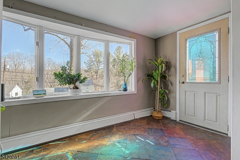 599 Berkshire Valley Road Wharton, NJ 07885 - Photo 5 of 20 a view of empty room with window and front door