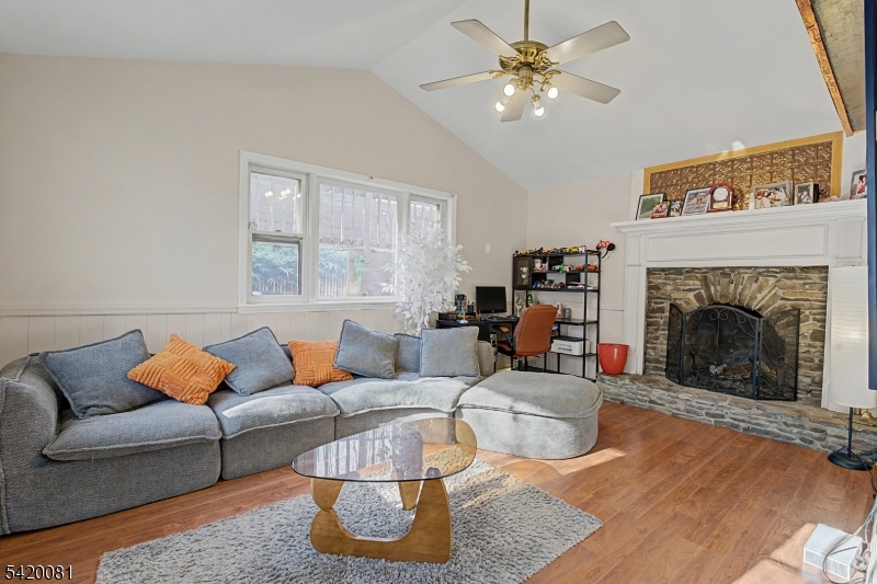 599 Berkshire Valley Road Wharton, NJ 07885 - Photo 6 of 20 a living room with furniture and a fireplace