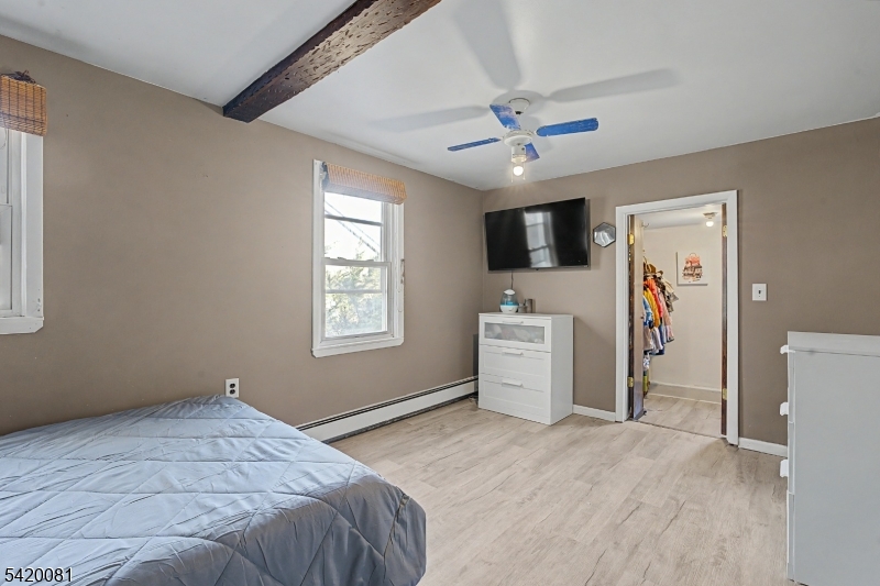 599 Berkshire Valley Road Wharton, NJ 07885 - Photo 9 of 20 a bedroom with a bed and a flat screen tv