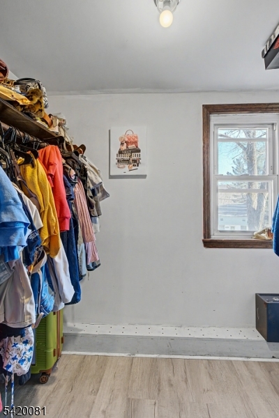 599 Berkshire Valley Road Wharton, NJ 07885 - Photo 10 of 20 a view of walk in closet with clothes and shoes