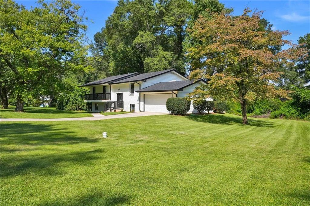2121 Chevy Chase Lane Decatur, GA 30032 - Photo 1 of 1 a front view of a house with a yard