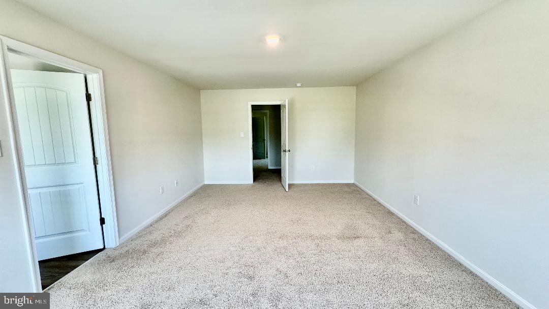 1236 Pimpernell Path Middletown, DE 19709 - Photo 12 of 37 an empty room with a bench and wooden floor