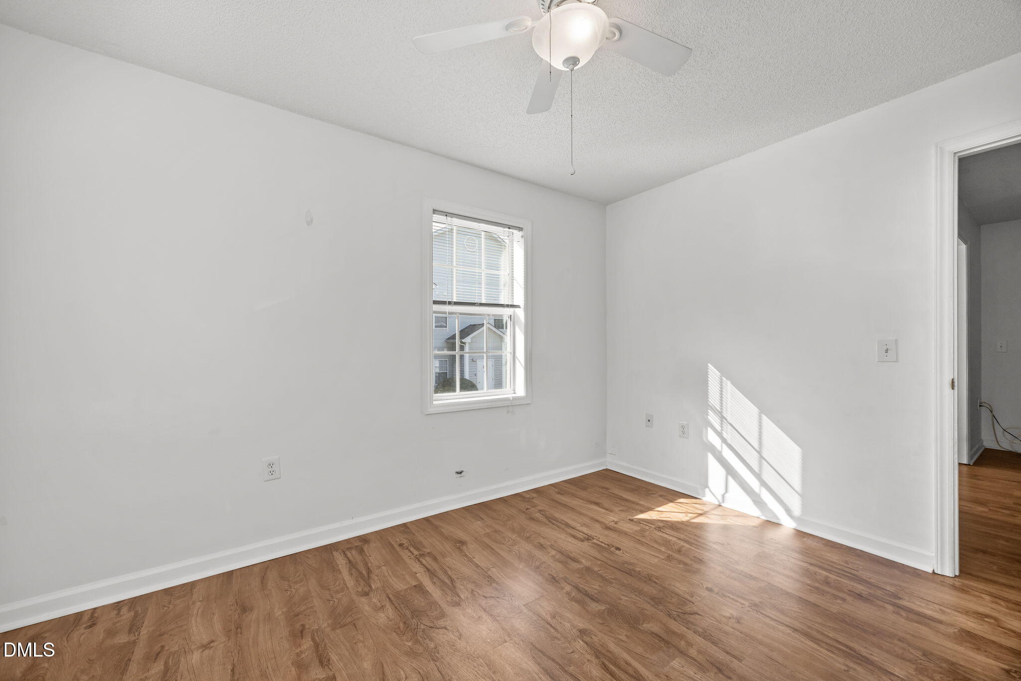 1303 Kent Road, Unit 204 Raleigh, NC 27606 - Photo 14 of 26 wooden floor in an empty room with a window