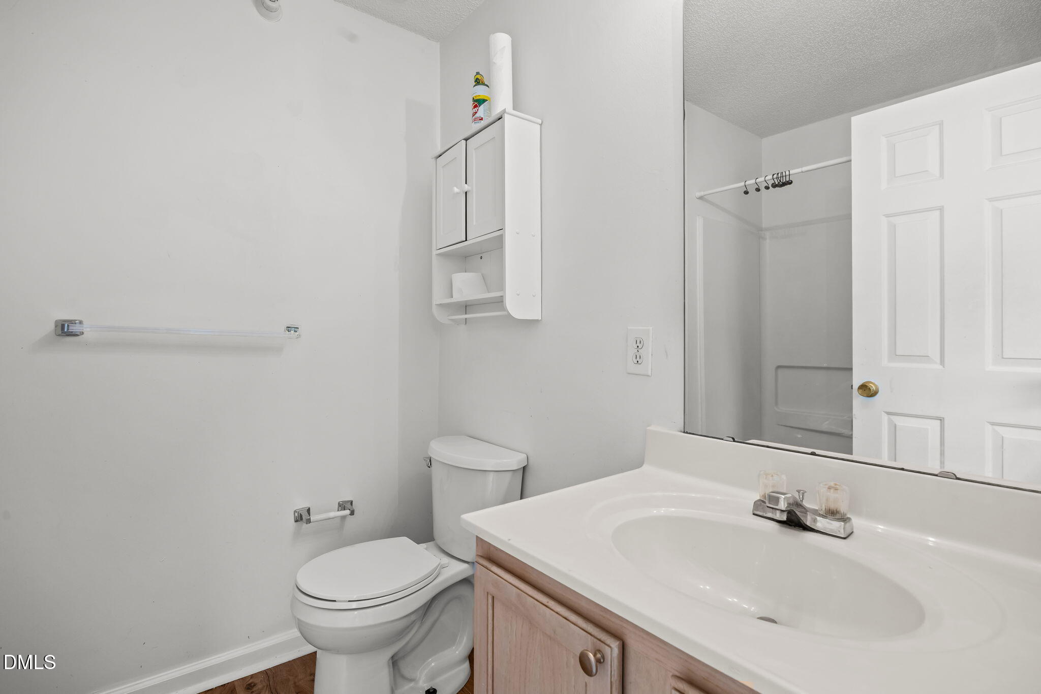 1303 Kent Road, Unit 204 Raleigh, NC 27606 - Photo 15 of 26 a bathroom with a sink toilet and shower