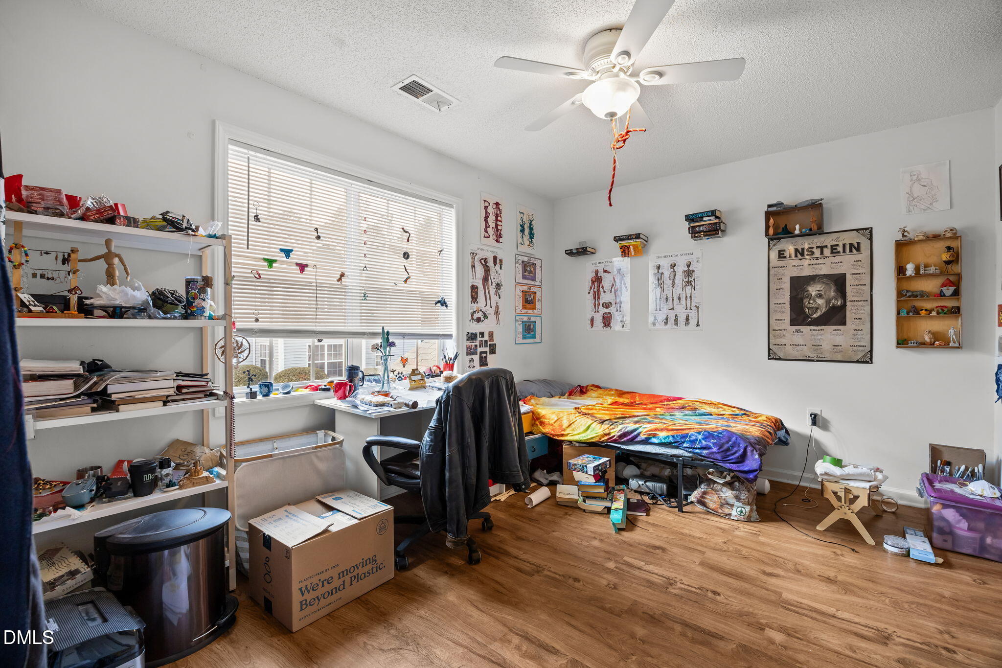 1303 Kent Road, Unit 204 Raleigh, NC 27606 - Photo 18 of 26 a living room with furniture and a flat screen tv