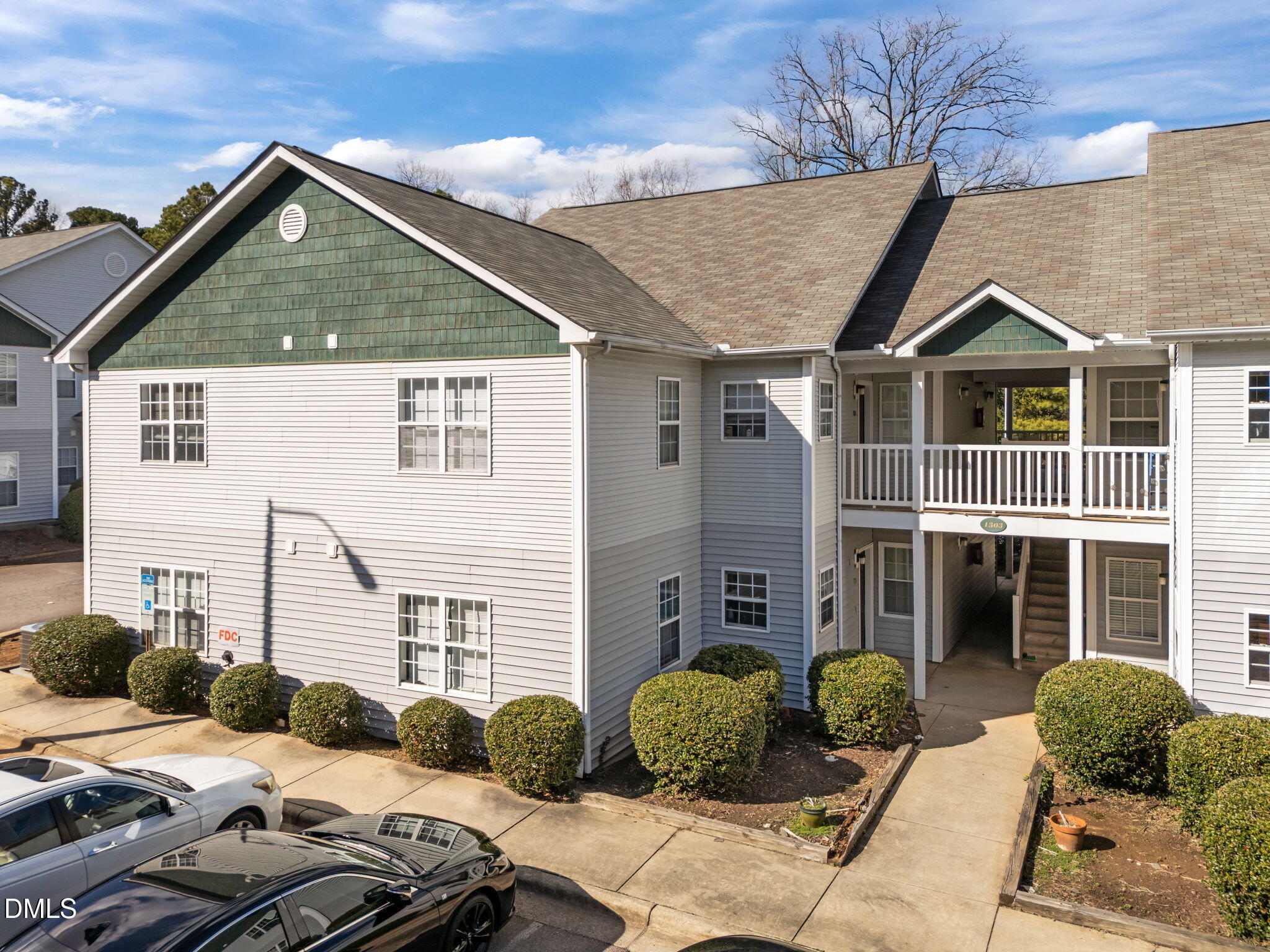 1303 Kent Road, Unit 204 Raleigh, NC 27606 - Photo 2 of 26 a view of a house with a yard