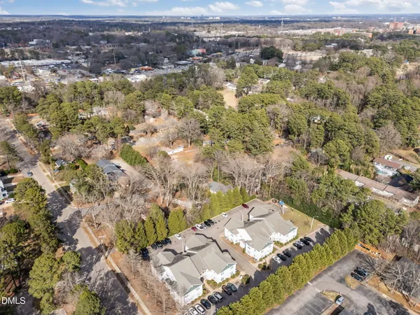 an aerial view of residential houses with outdoor space