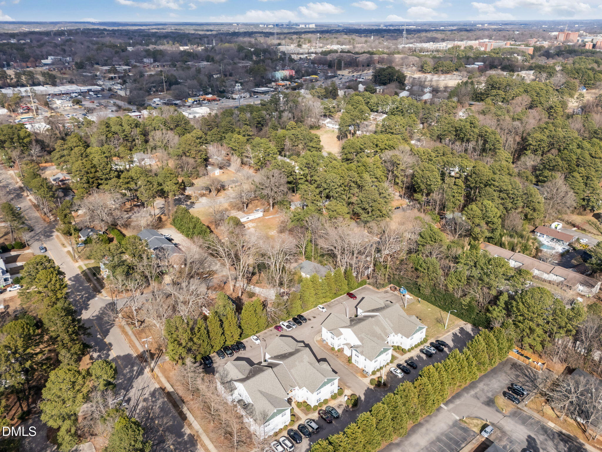 1303 Kent Road, Unit 204 Raleigh, NC 27606 - Photo 25 of 26 an aerial view of residential houses with outdoor space