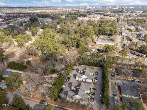 an aerial view of residential houses with outdoor space