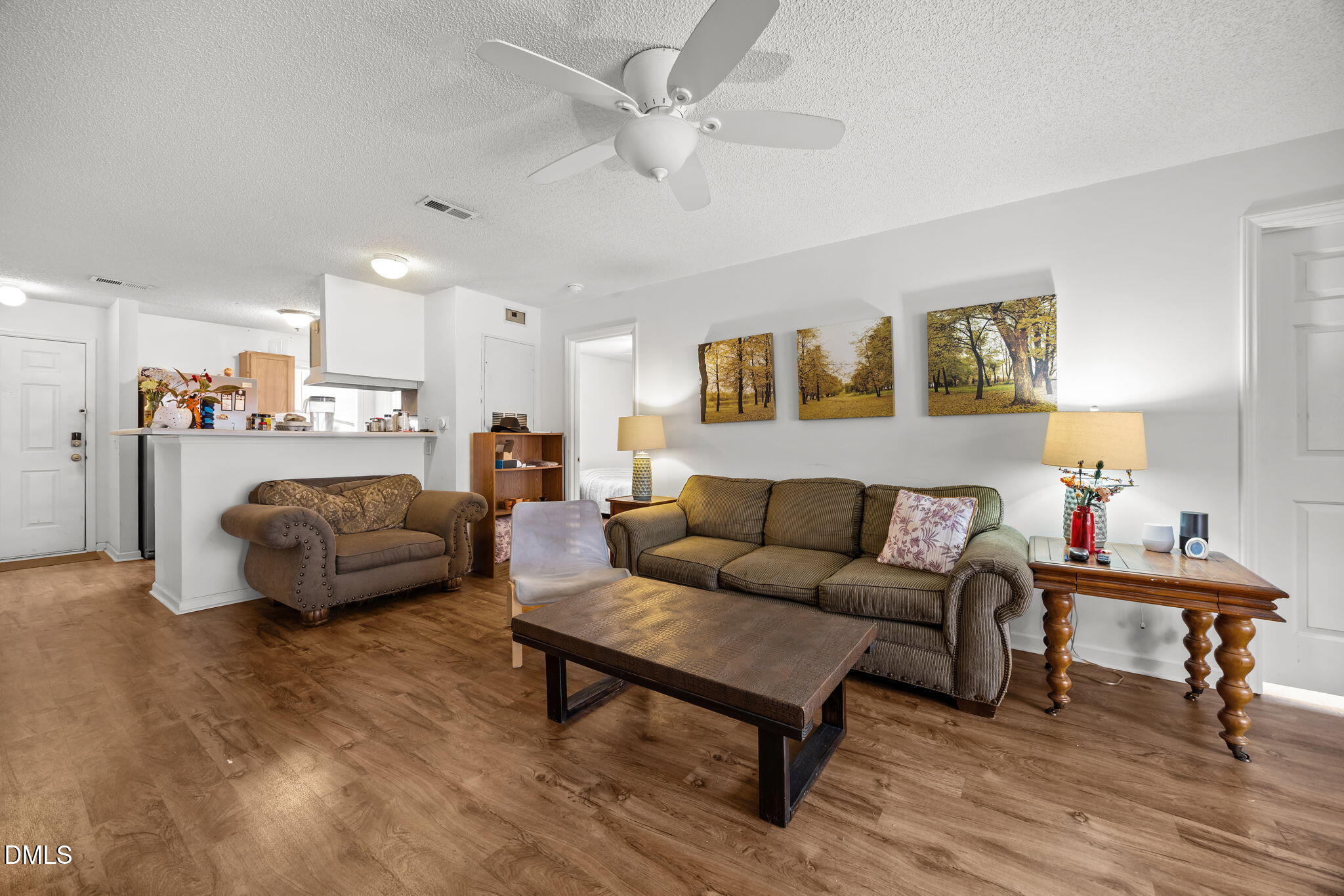 1303 Kent Road, Unit 204 Raleigh, NC 27606 - Photo 6 of 26 a living room with furniture and a couch