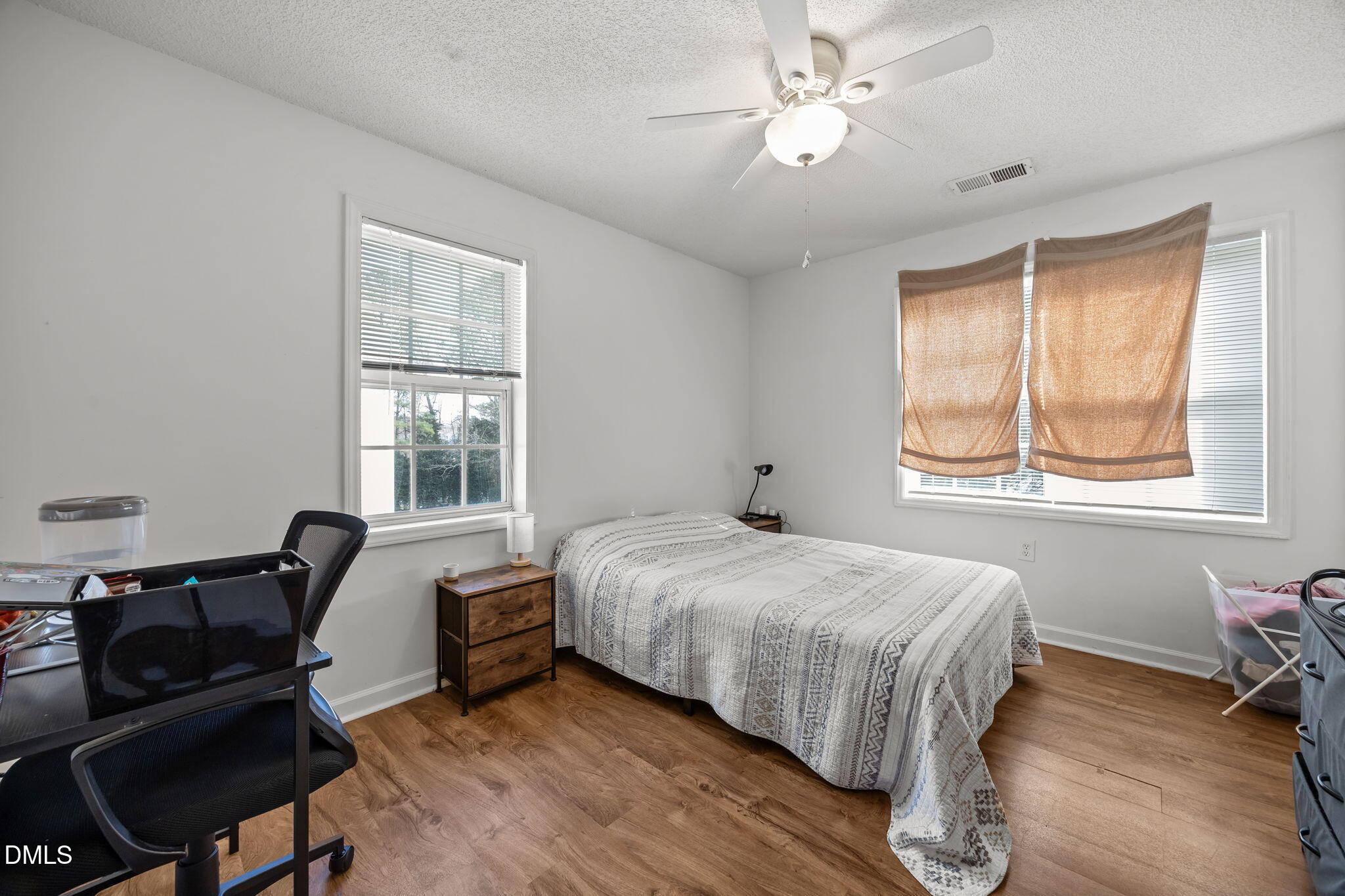 1303 Kent Road, Unit 204 Raleigh, NC 27606 - Photo 10 of 26 a bedroom with a bed and a window