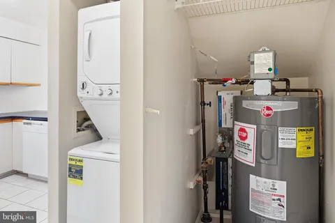 a view of storage and utility room with washer and dryer