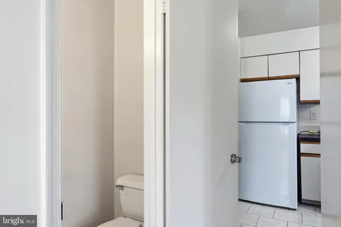 a view of bathroom with a refrigerator