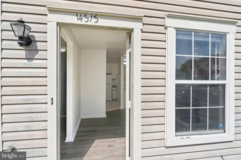 a view of front door and deck of the house
