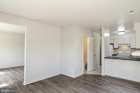 a view of kitchen with wooden floor