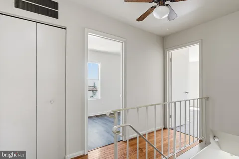 a view of an entryway with wooden floor