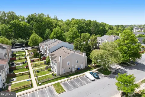 aerial view of a house with a yard