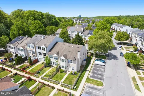 an aerial view of a house with a big yard