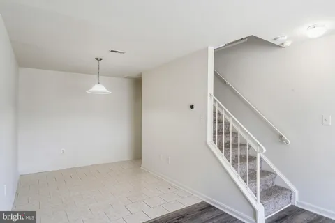 a view of a hallway with staircase