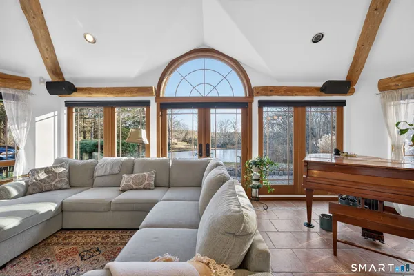 a living room with furniture and a large window