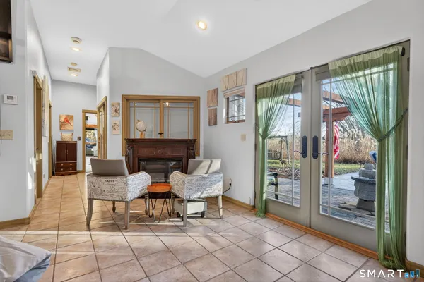 a view of a livingroom with furniture and a window