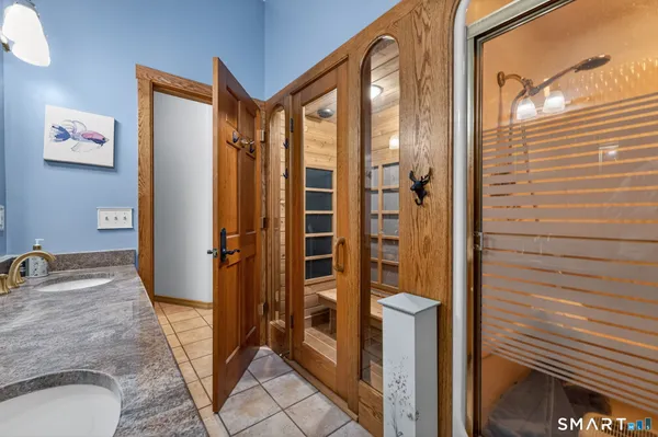 a bathroom with a tub and shower