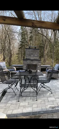 a view of an outdoor sitting area with furniture